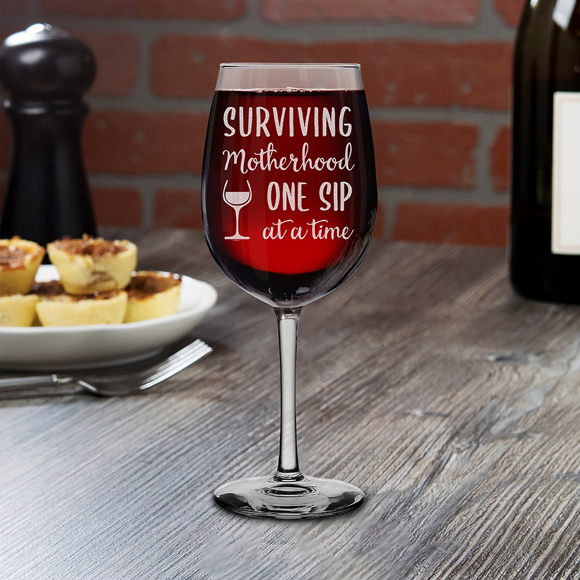 Surviving Motherhood One Sip At A Time Engraved Stemmed Wine Glass Funny New Mom Gift (16 oz.)